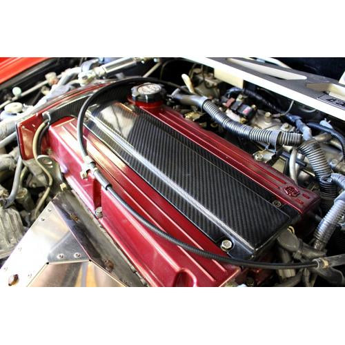 APR CARBON FIBER SPARK PLUG COVER: MITSUBISHI LANCER EVO 03-07